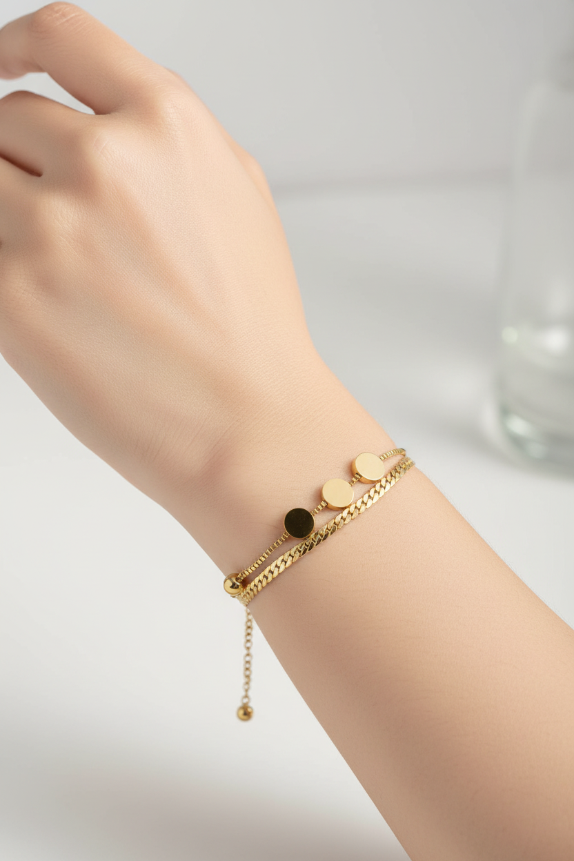 Gold layered bracelet on woman's hand